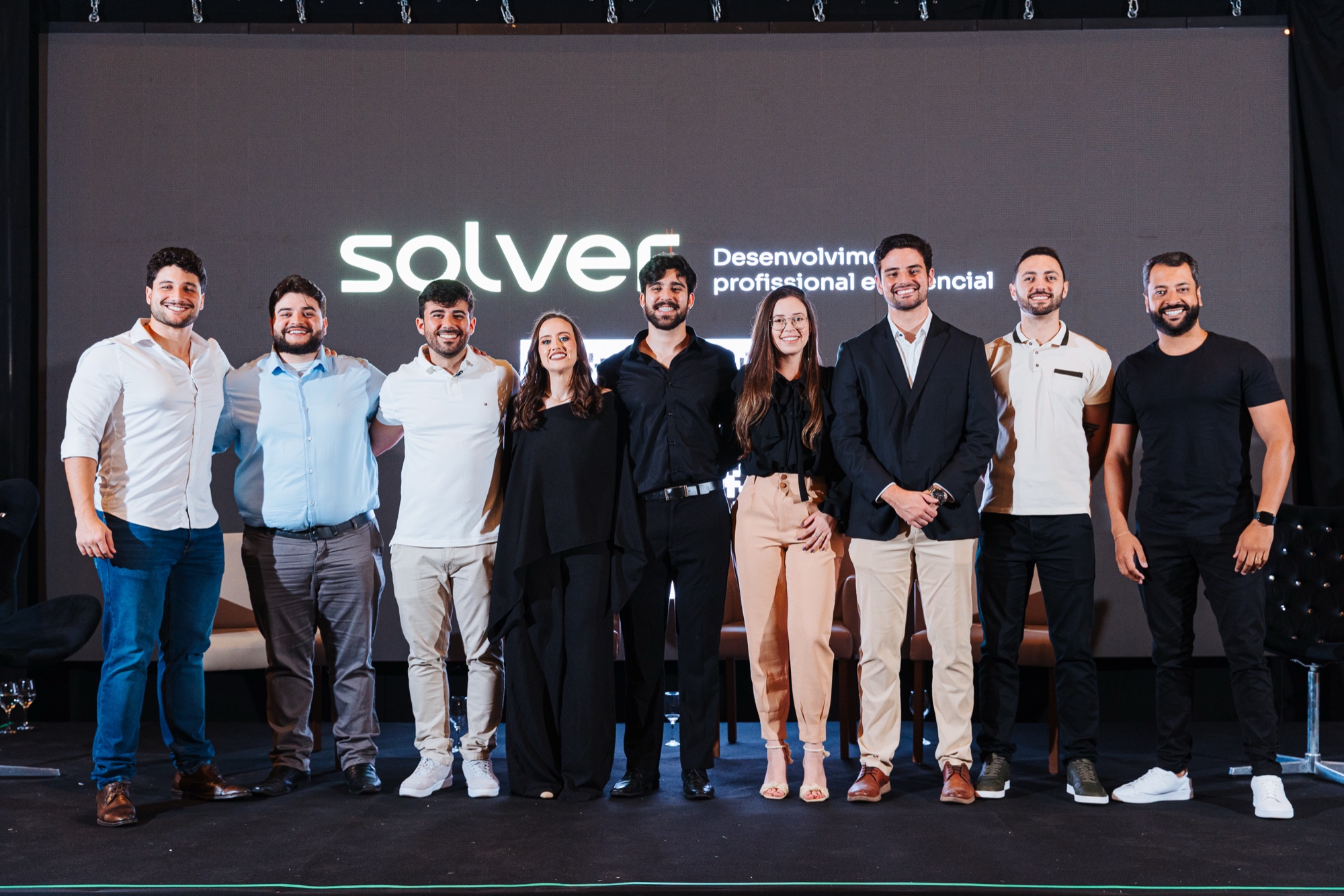 Os sócios do Solver Group reunidos no palco